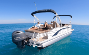 two women relaxing on pontoon charter in the ocean.