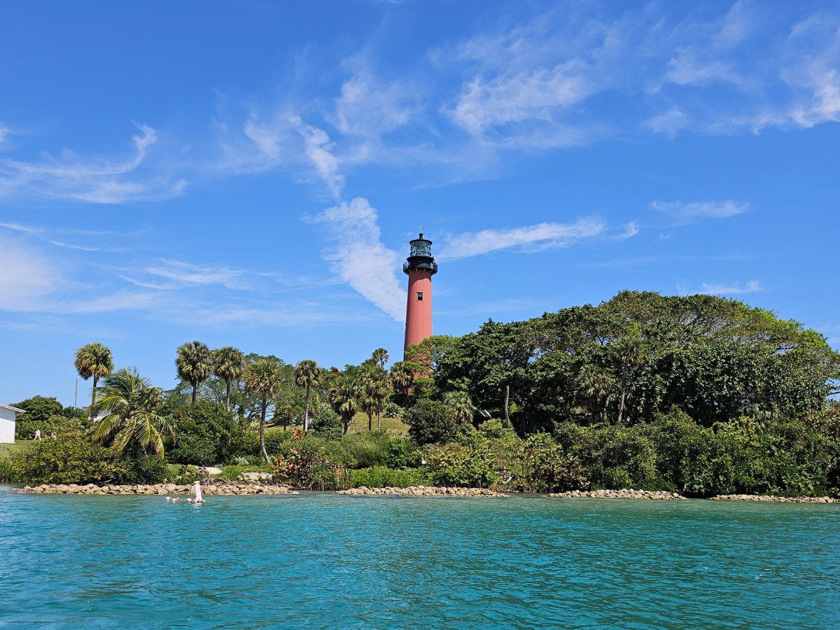 Jupiter Inlet Lighthouse viewed from the water during a Jupiter Island boat tour